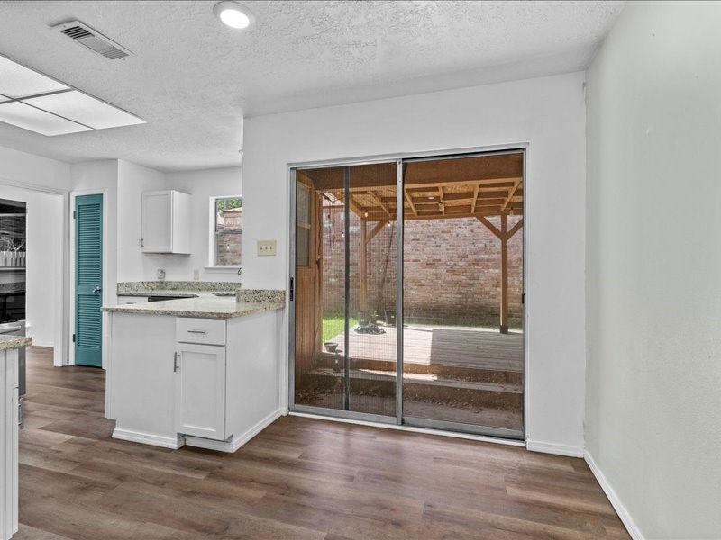 6631 Ambler Drive Spring, TX 77379 - Photo 8 of 37 a room with wooden floor and window