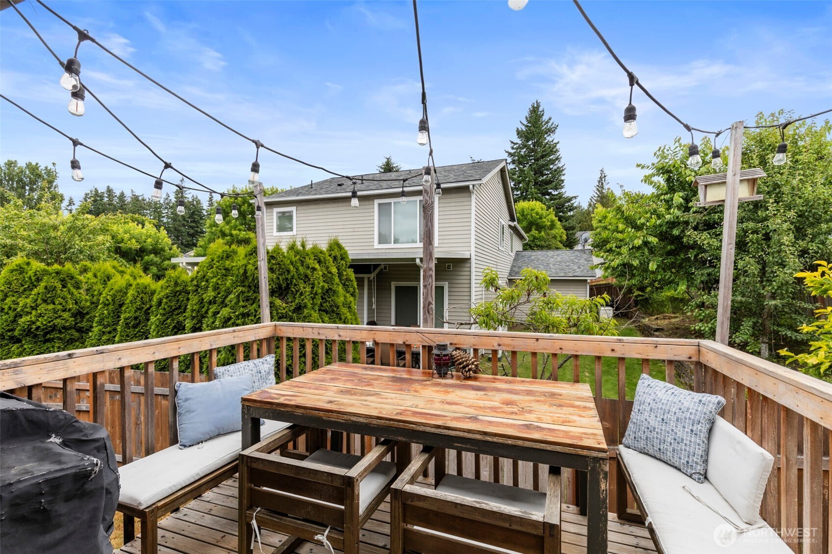 2954 Lowren Loop Port Orchard, WA 98366 - Photo 12 of 30 a view of a deck with a table and chairs