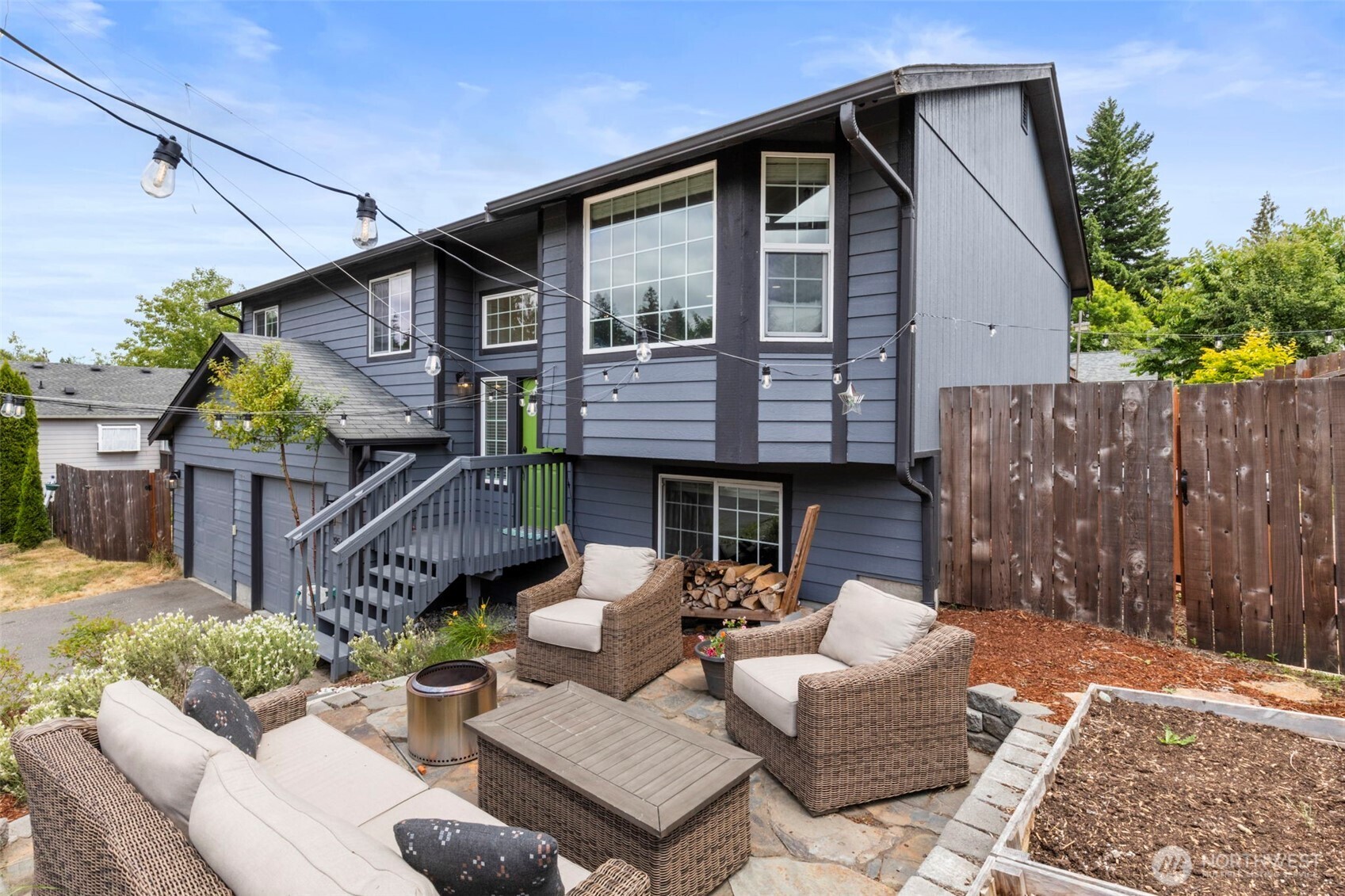 2954 Lowren Loop Port Orchard, WA 98366 - Photo 2 of 30 a view of a patio with couches and a table and chairs with wooden fence