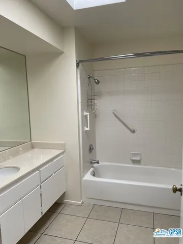 a view of a swimming pool with a table and chairs