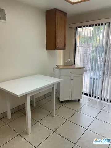 a view of kitchen with workspace and window