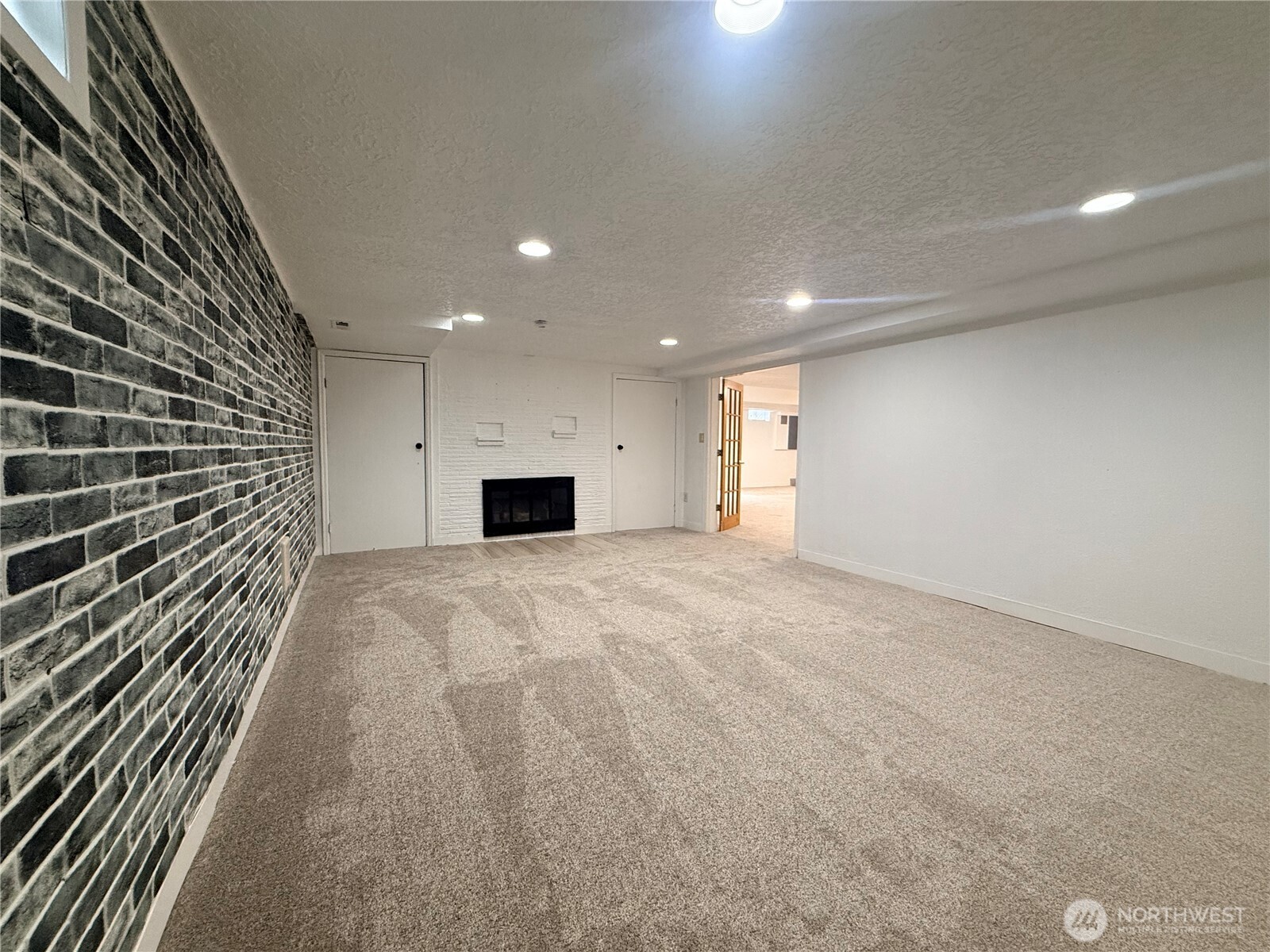 2126 Lewis River Road Woodland, WA 98674 - Photo 21 of 23 a view of empty room with a fireplace