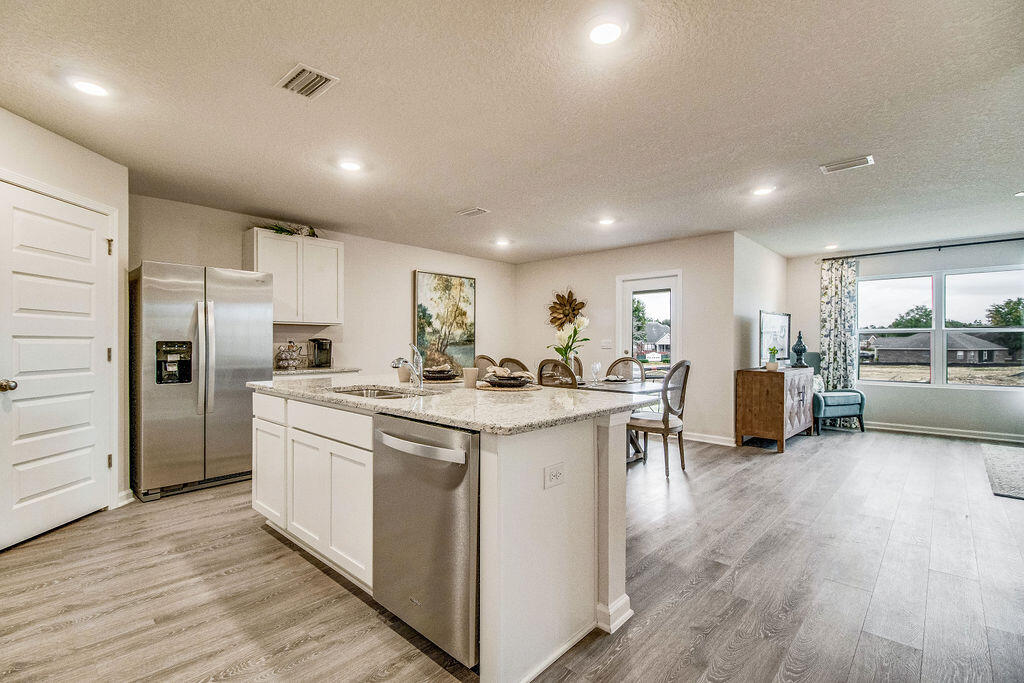 2846 Patriots Rdg Drive Crestview, FL 32539 - Photo 2 of 33 a kitchen with stainless steel appliances granite countertop a lot of counter top space and refrigerator
