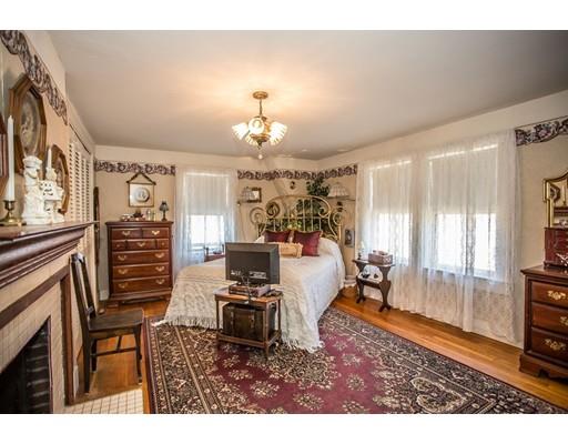 168 North End Road Townsend, MA 01469 - Photo 25 of 29 a living room with furniture a chandelier and a flat screen tv