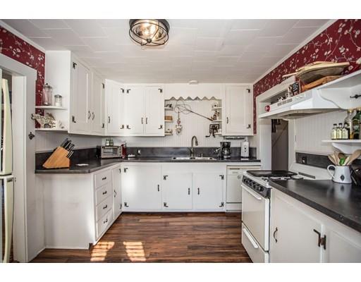 168 North End Road Townsend, MA 01469 - Photo 7 of 29 a kitchen with stainless steel appliances a stove a sink and cabinets