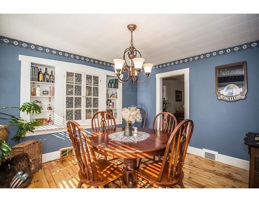 168 North End Road Townsend, MA 01469 - Photo 9 of 29 a dining room with furniture a chandelier and wooden floor