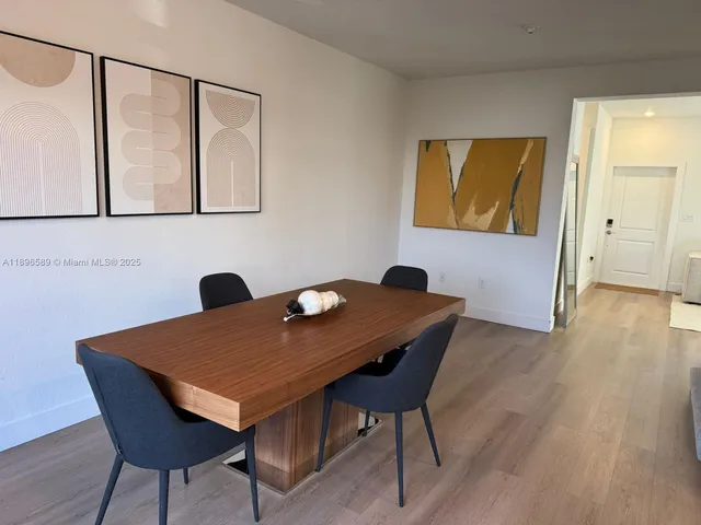 a view of a workspace with furniture