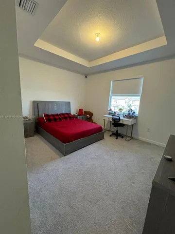 a bedroom with furniture and window
