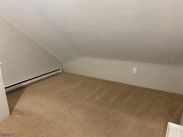 a view of a refrigerator in a room