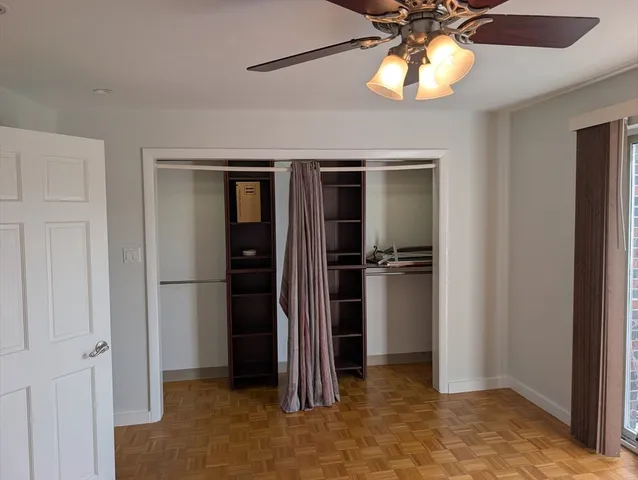 a view of a kitchen with a refrigerator and a chandelier