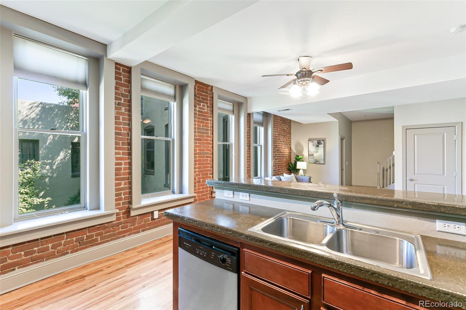 3211 Zuni Street, Unit 4 Denver, CO 80211 - Photo 17 of 35 a view of a kitchen with a sink and a window