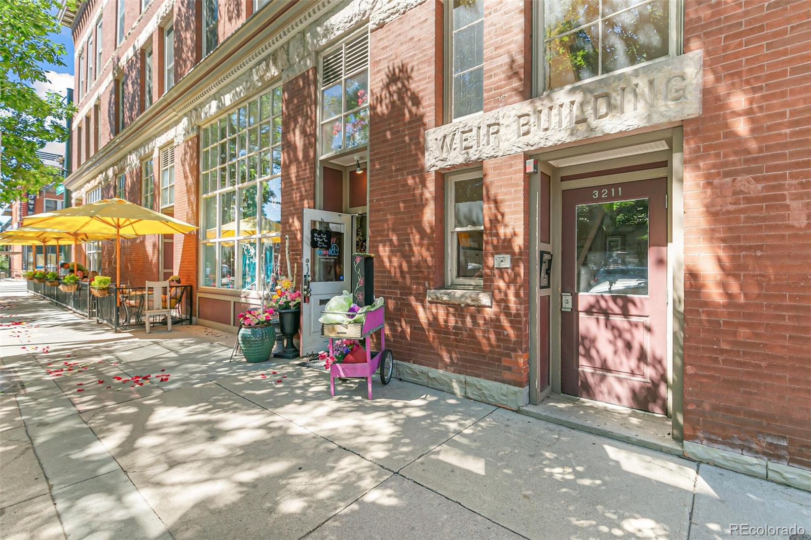 3211 Zuni Street, Unit 4 Denver, CO 80211 - Photo 3 of 35 a view of a brick building with many windows