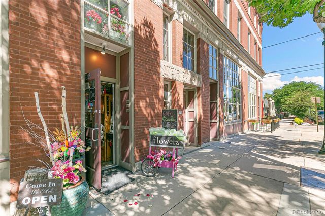 a view of path along with flowers and building