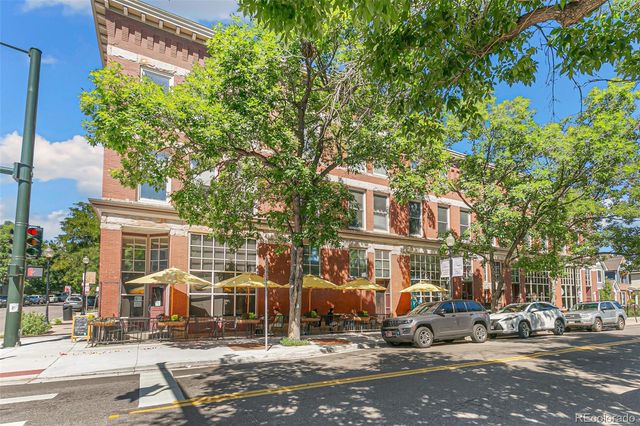 a front view of a building with street view