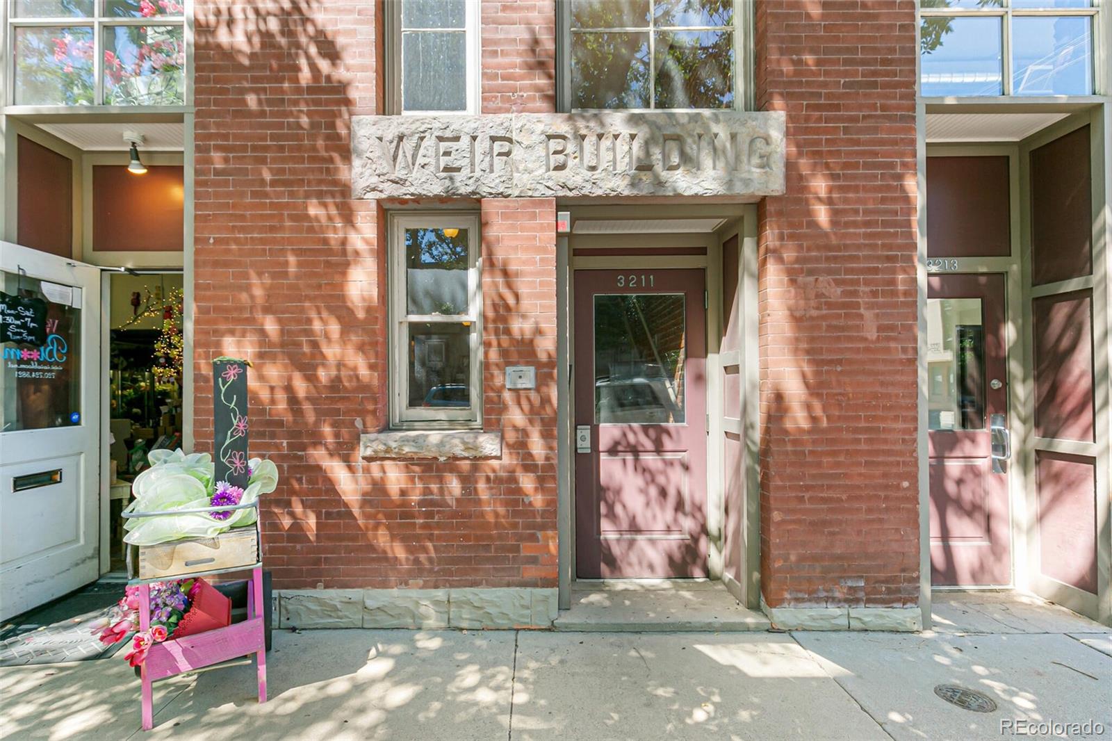 3211 Zuni Street, Unit 4 Denver, CO 80211 - Photo 4 of 35 a front view of a house with an outdoor space
