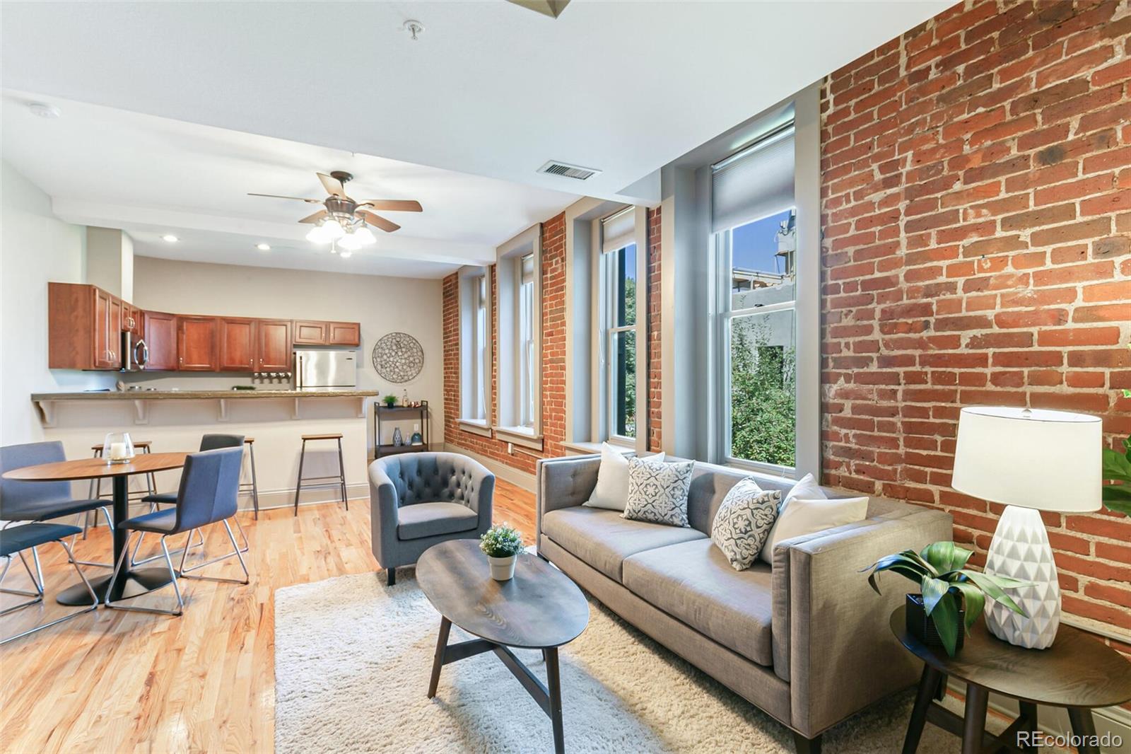 3211 Zuni Street, Unit 4 Denver, CO 80211 - Photo 5 of 35 a living room with furniture and a large window