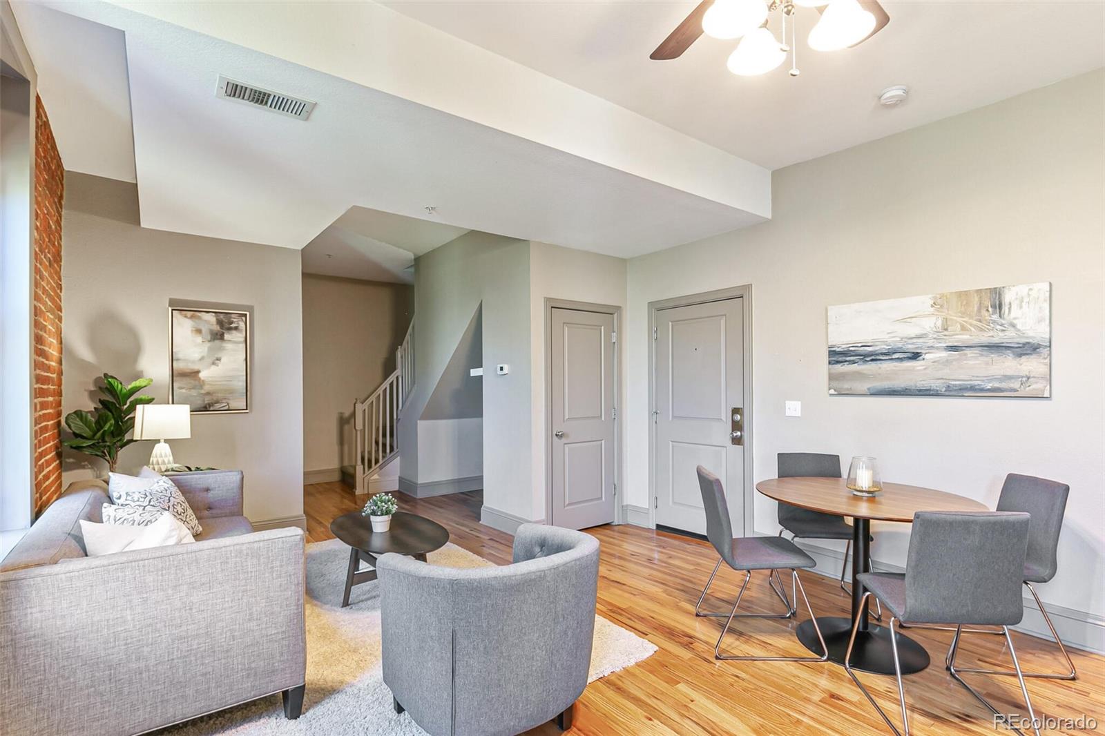 3211 Zuni Street, Unit 4 Denver, CO 80211 - Photo 8 of 35 a living room with furniture and a large window