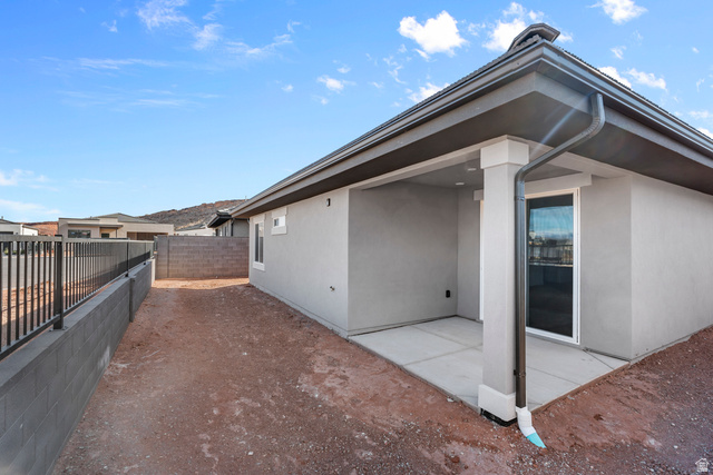 1589 South Fins Road, Unit 4178 Washington, UT 84780 - Photo 5 of 30 Covered patio with a concrete slab, stucco exterior, and a sliding glass door