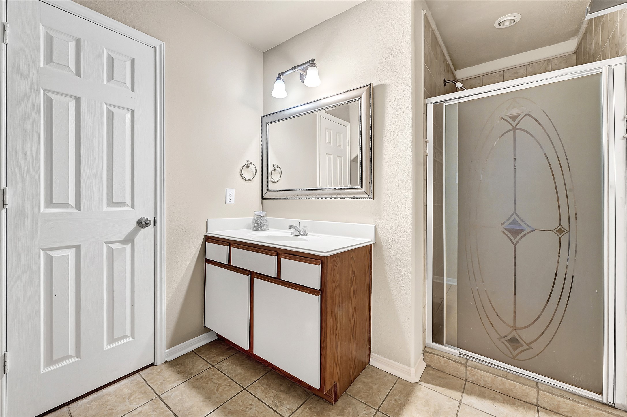 3603 Barkers Crossing Avenue Houston, TX 77084 - Photo 13 of 34 a bathroom with a sink mirror and a shower