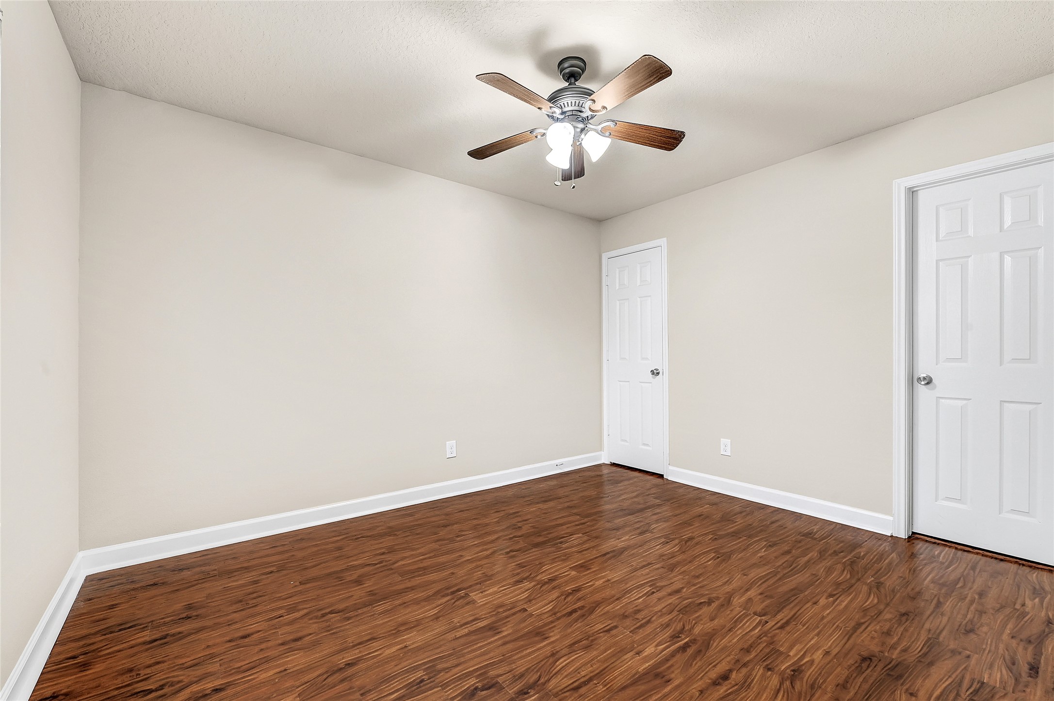 3603 Barkers Crossing Avenue Houston, TX 77084 - Photo 14 of 34 an empty room with wooden floor and windows