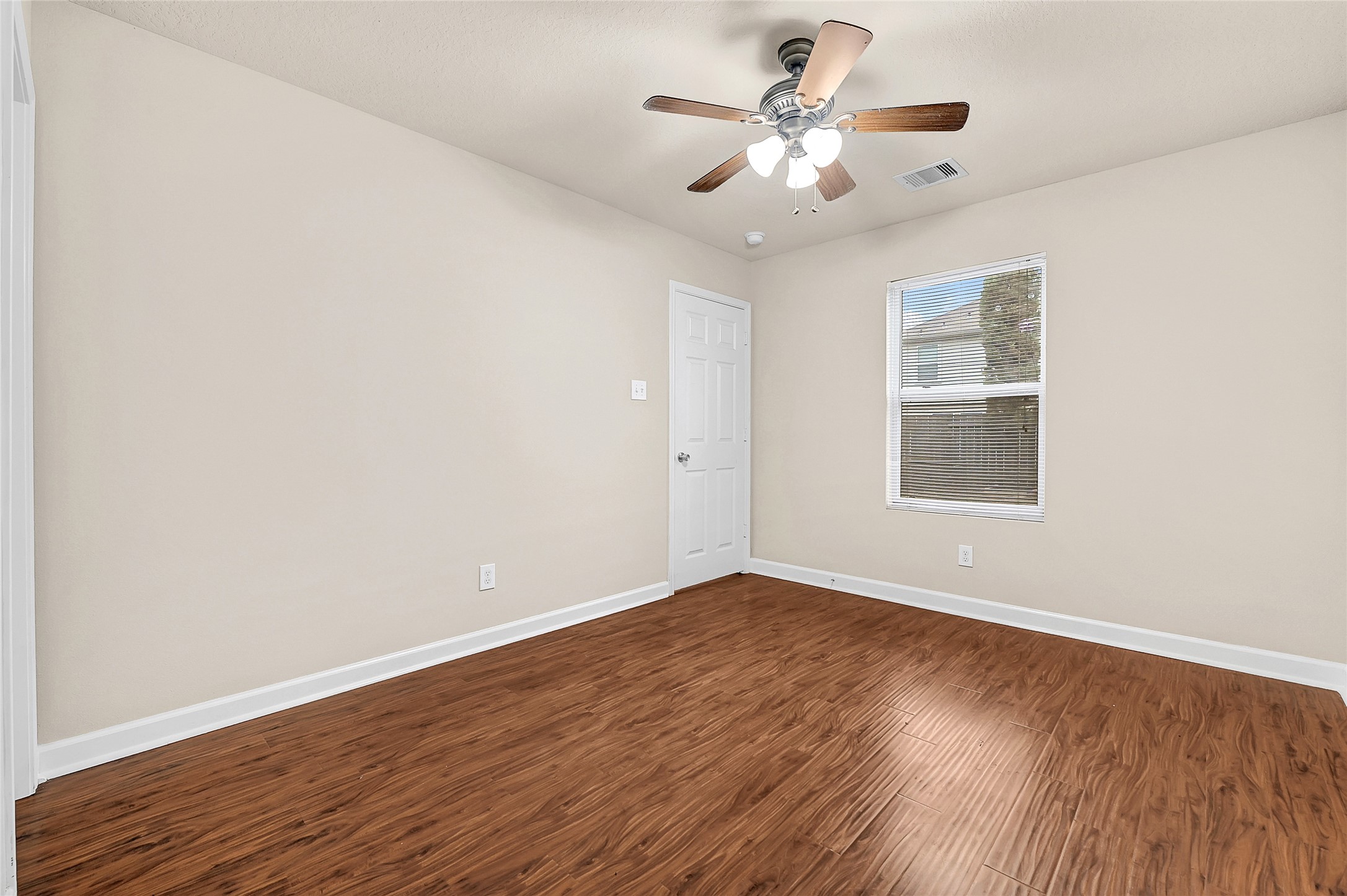 3603 Barkers Crossing Avenue Houston, TX 77084 - Photo 15 of 34 wooden floor in an empty room with a window