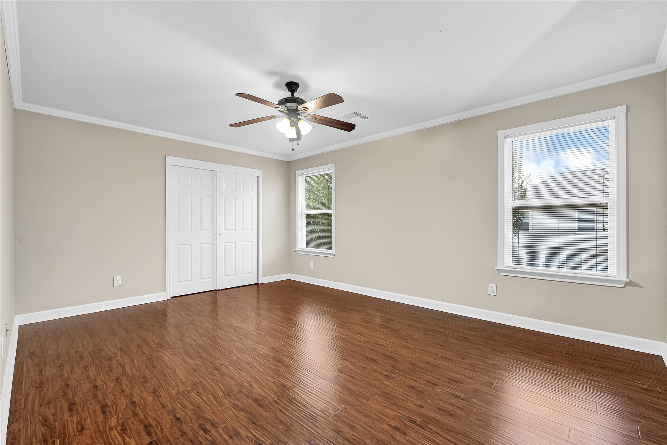 3603 Barkers Crossing Avenue Houston, TX 77084 - Photo 19 of 34 a view of an empty room with a window and wooden floor