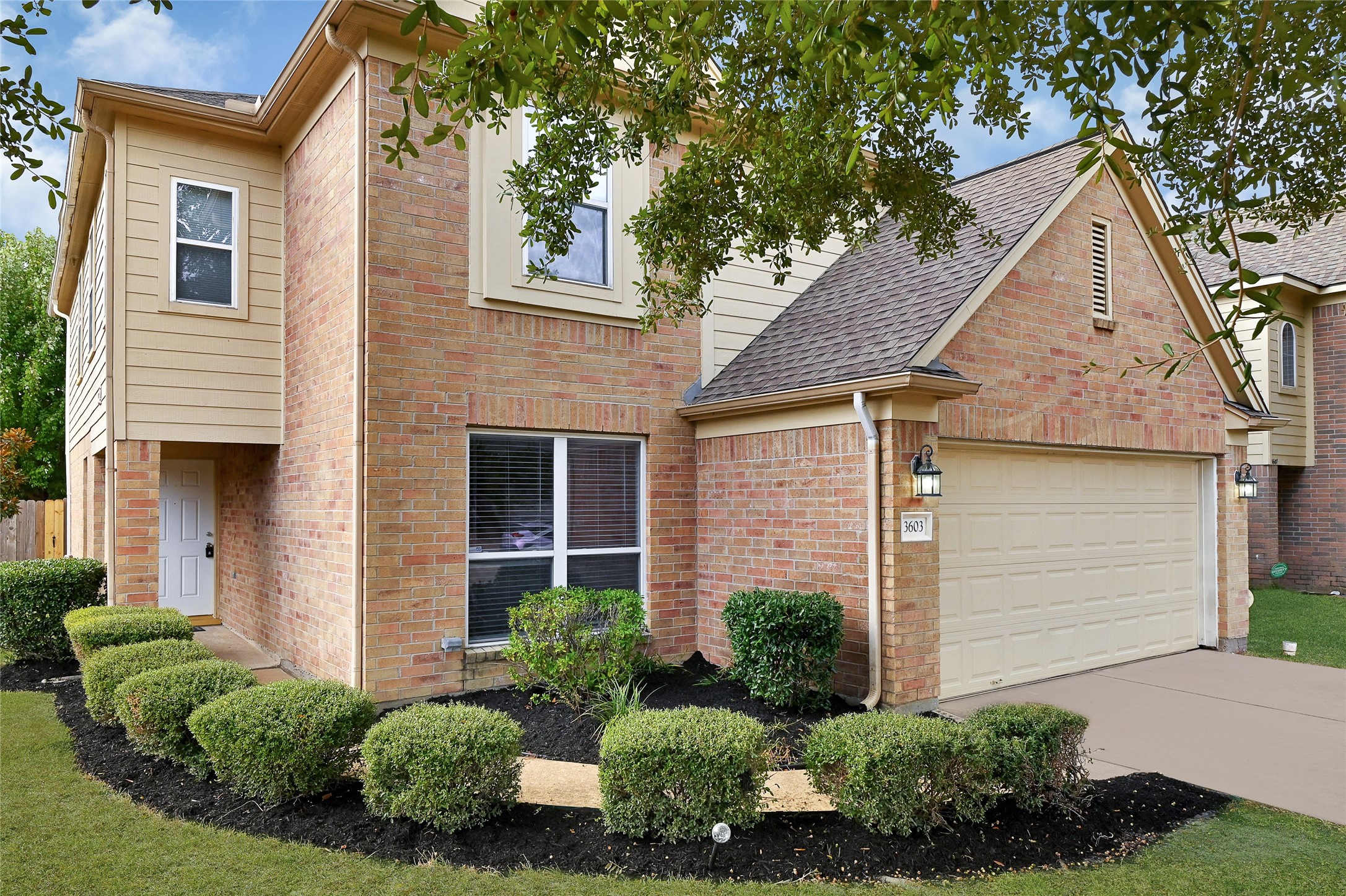 3603 Barkers Crossing Avenue Houston, TX 77084 - Photo 2 of 34 a view of a white house next to a yard