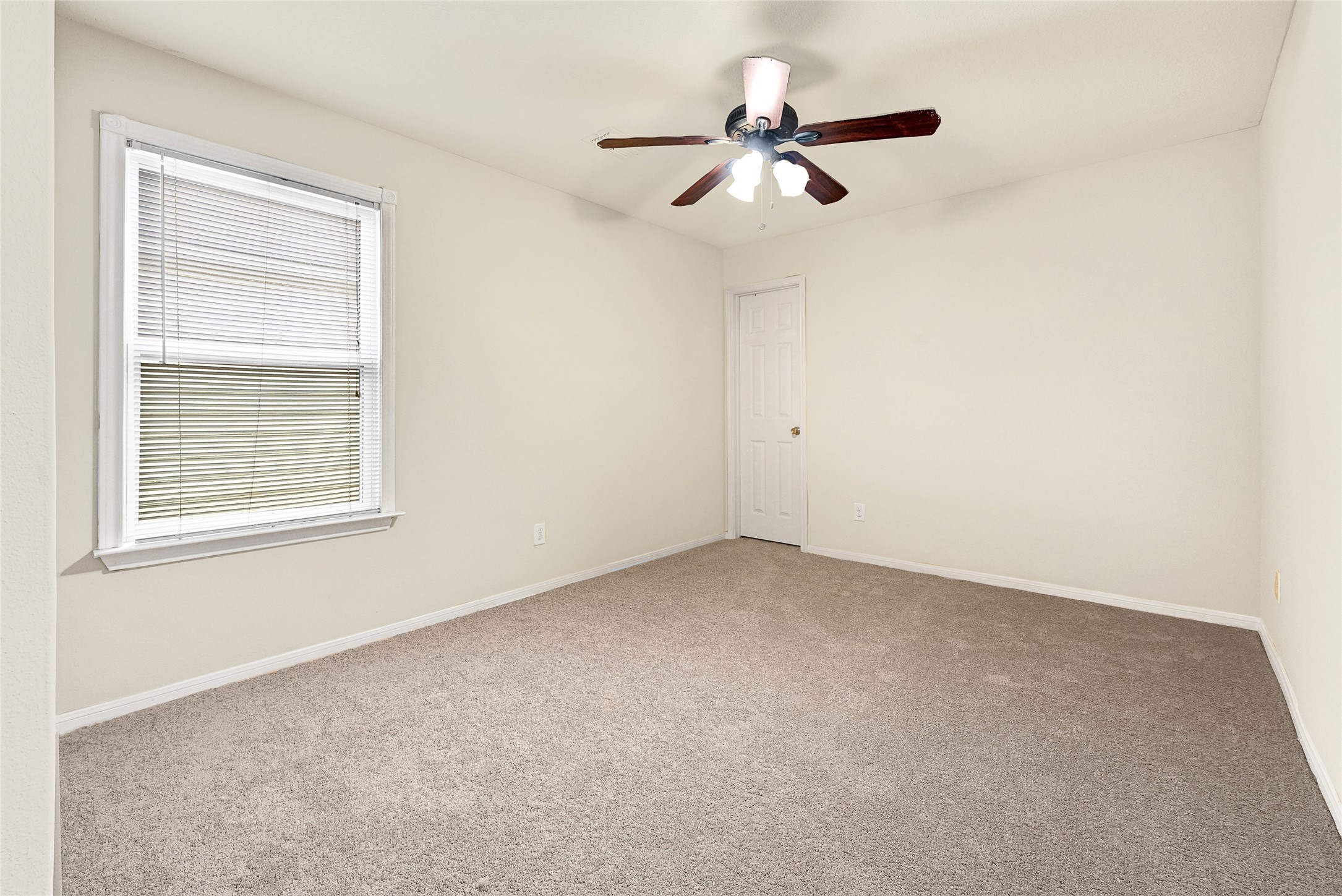 3603 Barkers Crossing Avenue Houston, TX 77084 - Photo 27 of 34 an empty room with a window and a fan