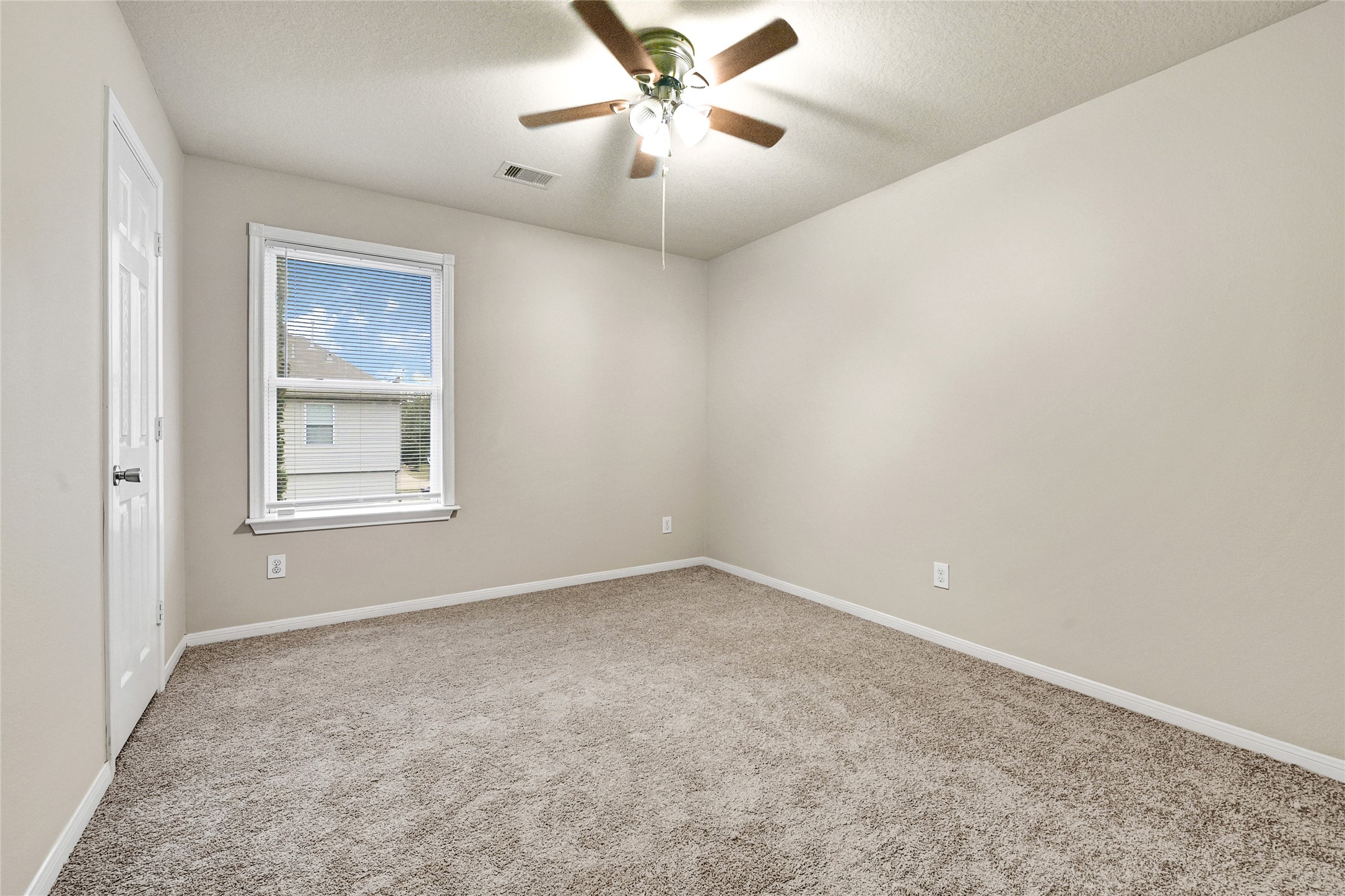 3603 Barkers Crossing Avenue Houston, TX 77084 - Photo 30 of 34 an empty room with windows and fan