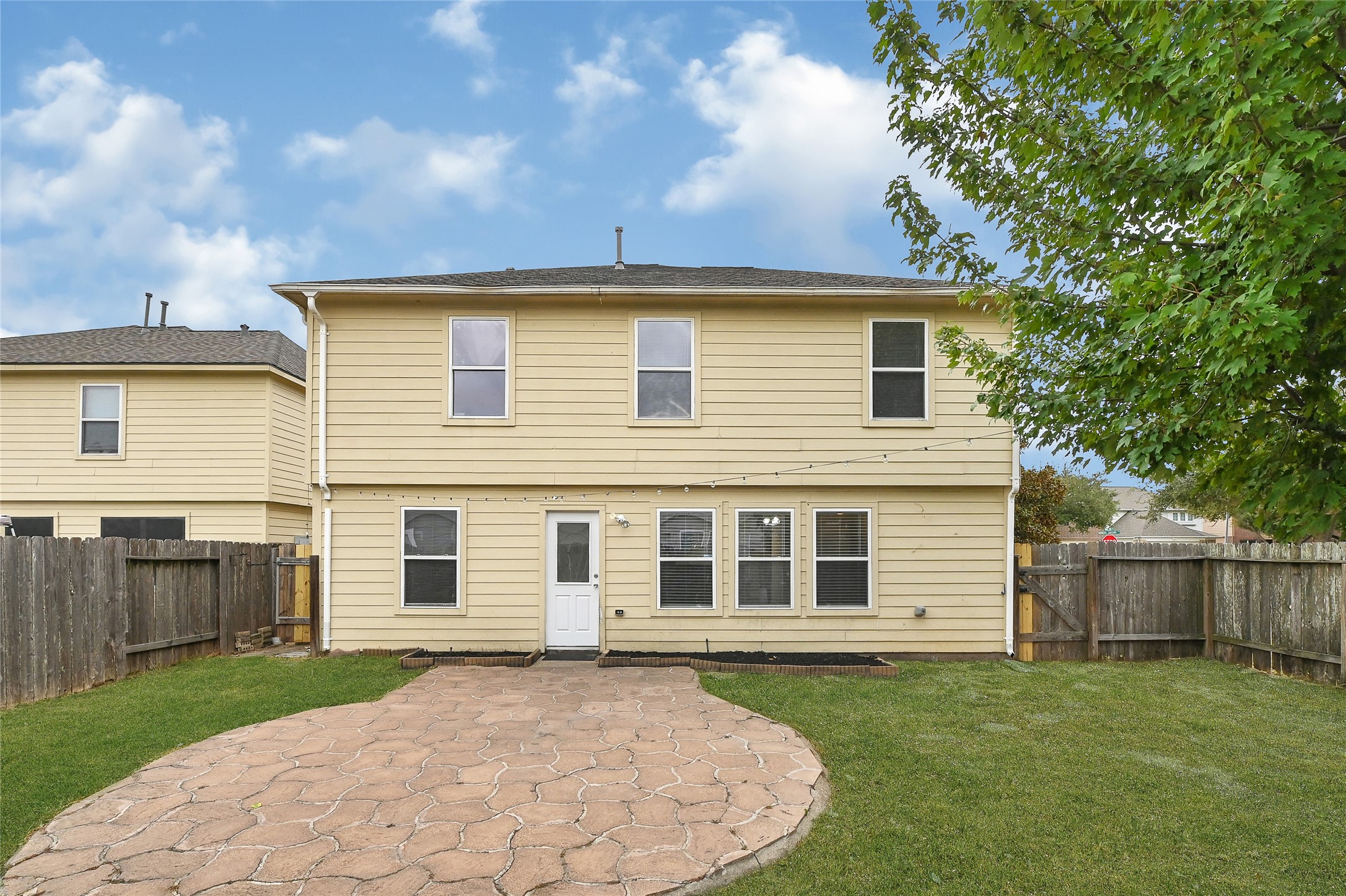 3603 Barkers Crossing Avenue Houston, TX 77084 - Photo 31 of 34 a front view of a house with a garden