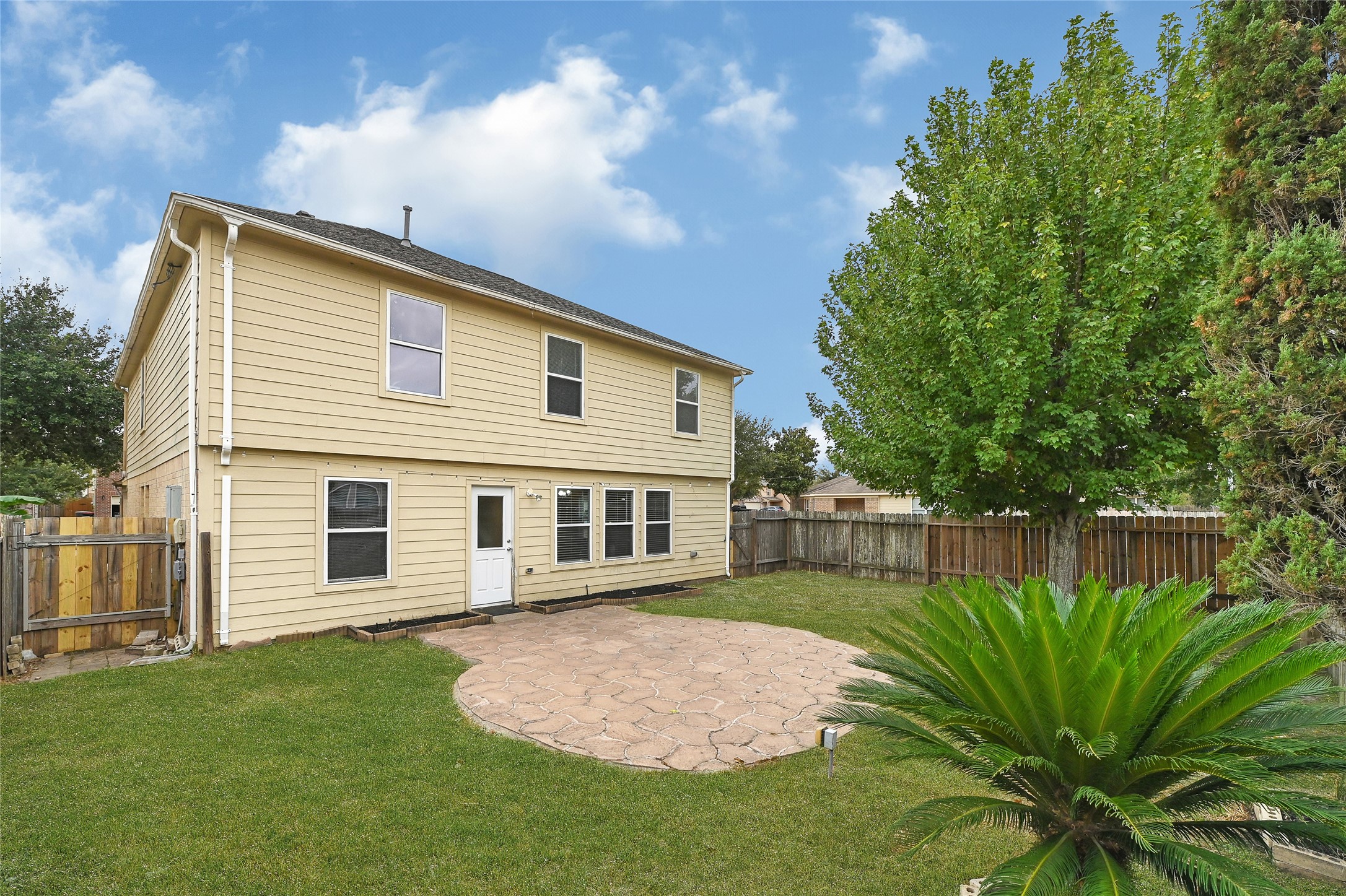 3603 Barkers Crossing Avenue Houston, TX 77084 - Photo 32 of 34 a front view of a house with a garden and yard