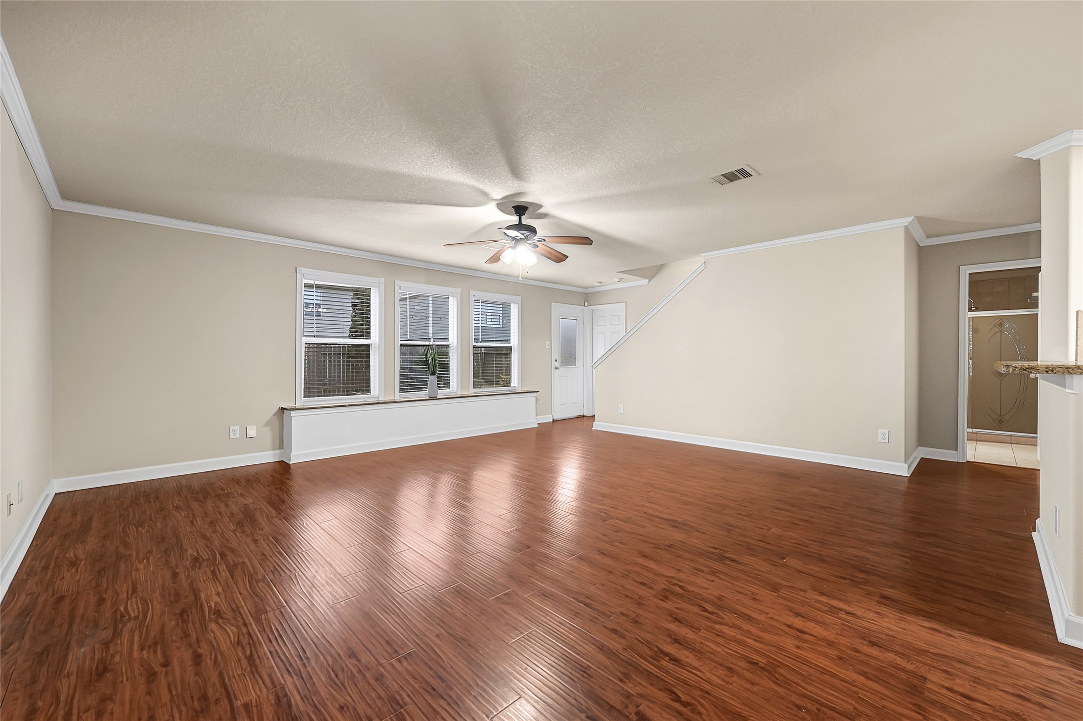 3603 Barkers Crossing Avenue Houston, TX 77084 - Photo 6 of 34 a view of an empty room with wooden floor and a window