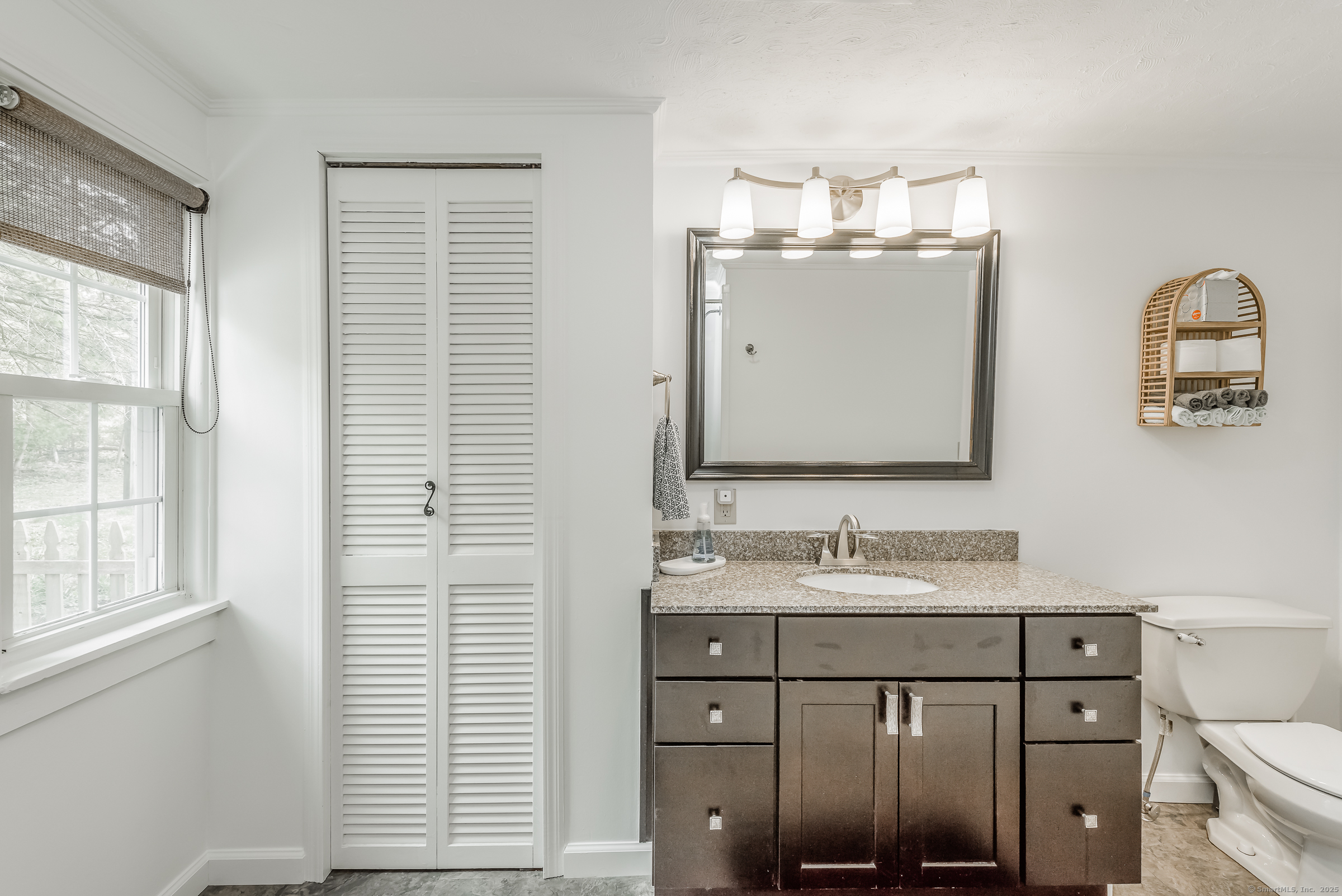21 Elsmere Road Hebron, CT 06231 - Photo 11 of 31 a bathroom with a sink and a mirror