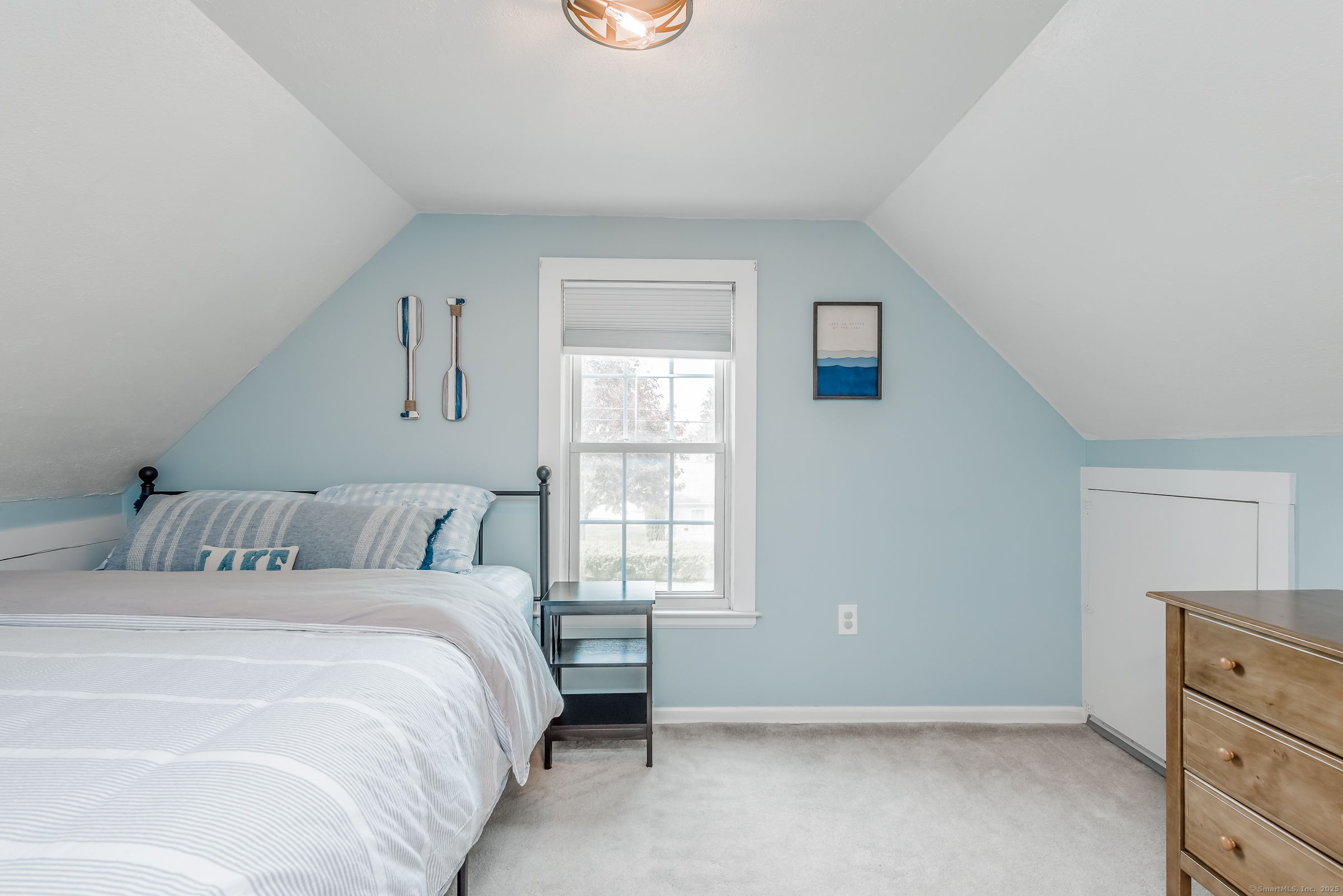 21 Elsmere Road Hebron, CT 06231 - Photo 20 of 31 a bedroom with a bed and a window