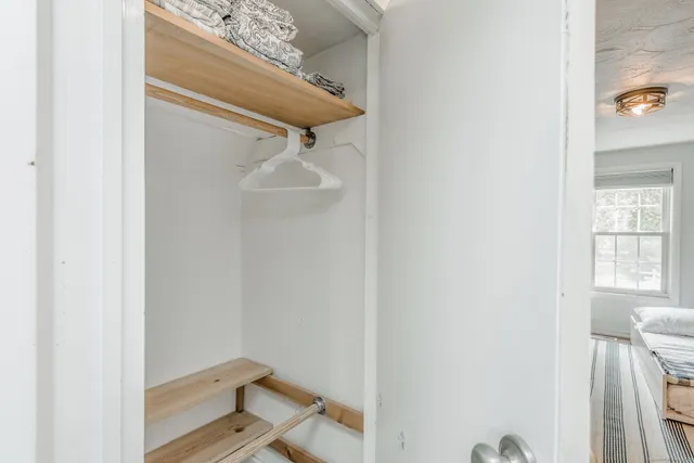 a bathroom with a window and a shower