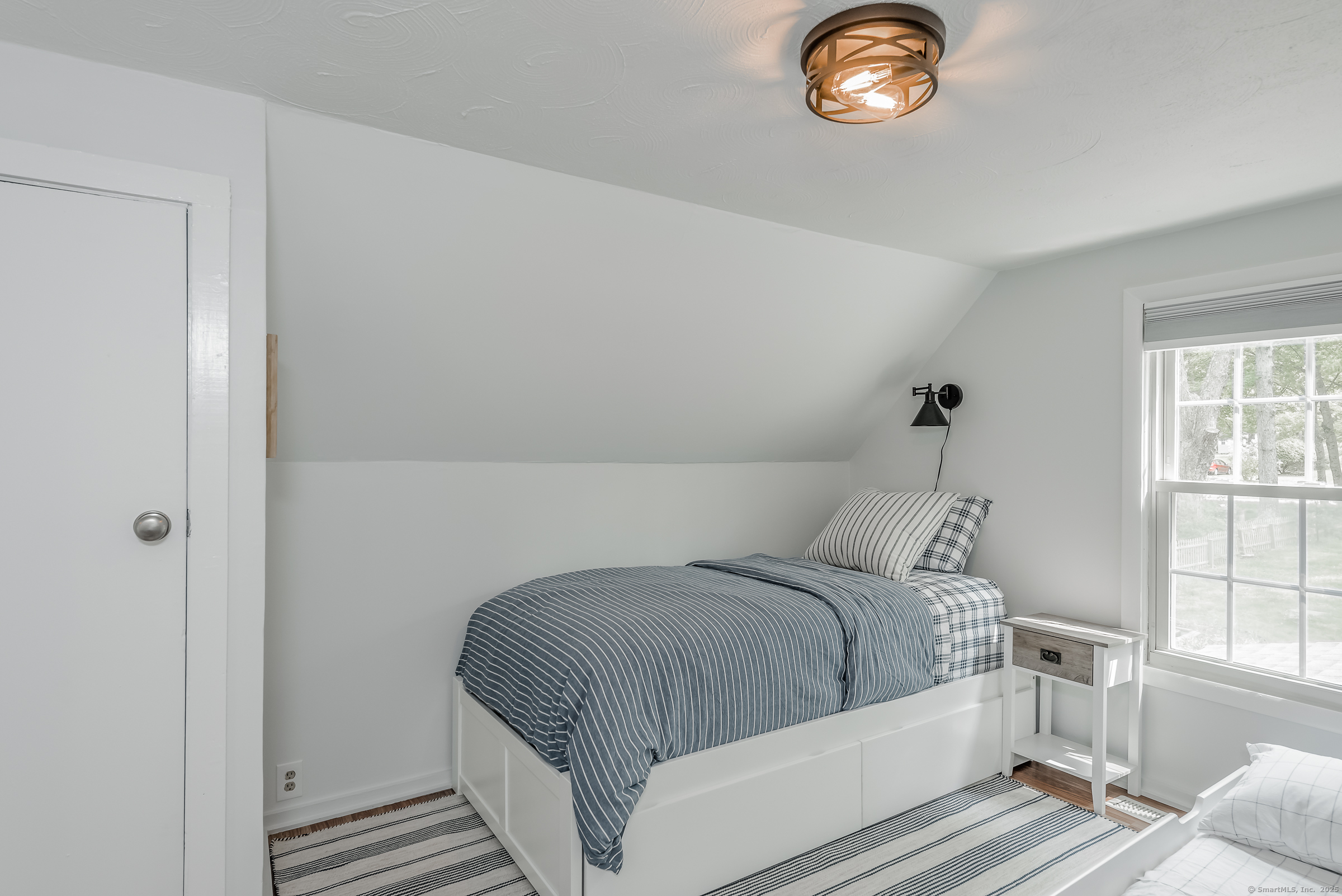 21 Elsmere Road Hebron, CT 06231 - Photo 24 of 31 a bedroom with a bed and a window