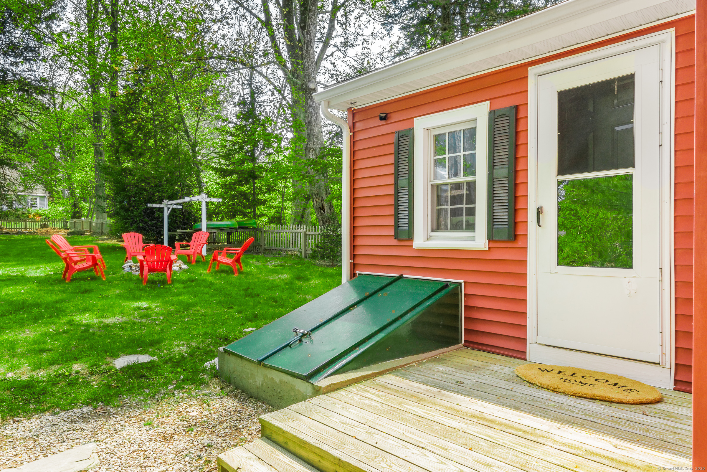 21 Elsmere Road Hebron, CT 06231 - Photo 25 of 31 a view of a backyard with plants and a garden