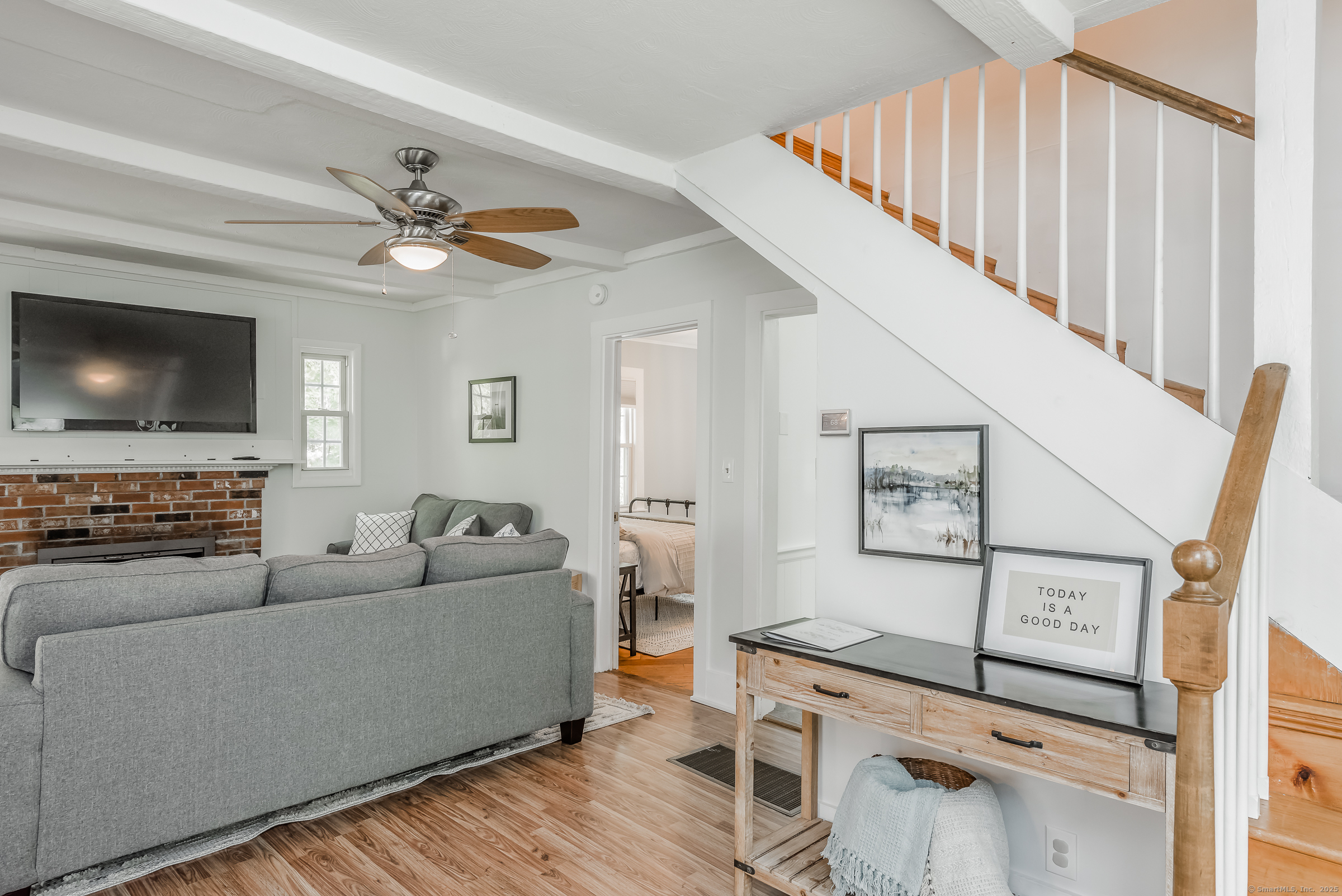 21 Elsmere Road Hebron, CT 06231 - Photo 6 of 31 a living room with furniture and a flat screen tv