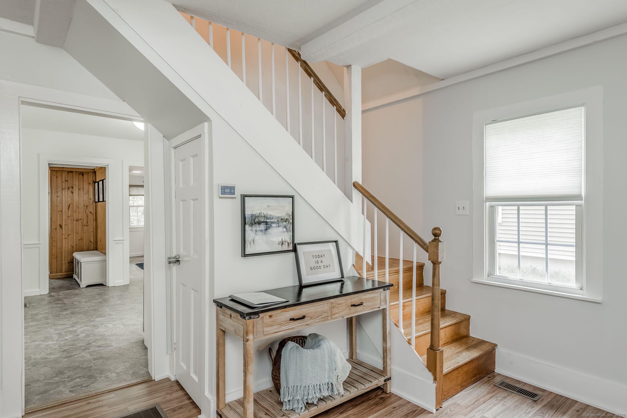 21 Elsmere Road Hebron, CT 06231 - Photo 7 of 31 a view of entryway with wooden floor and staircase