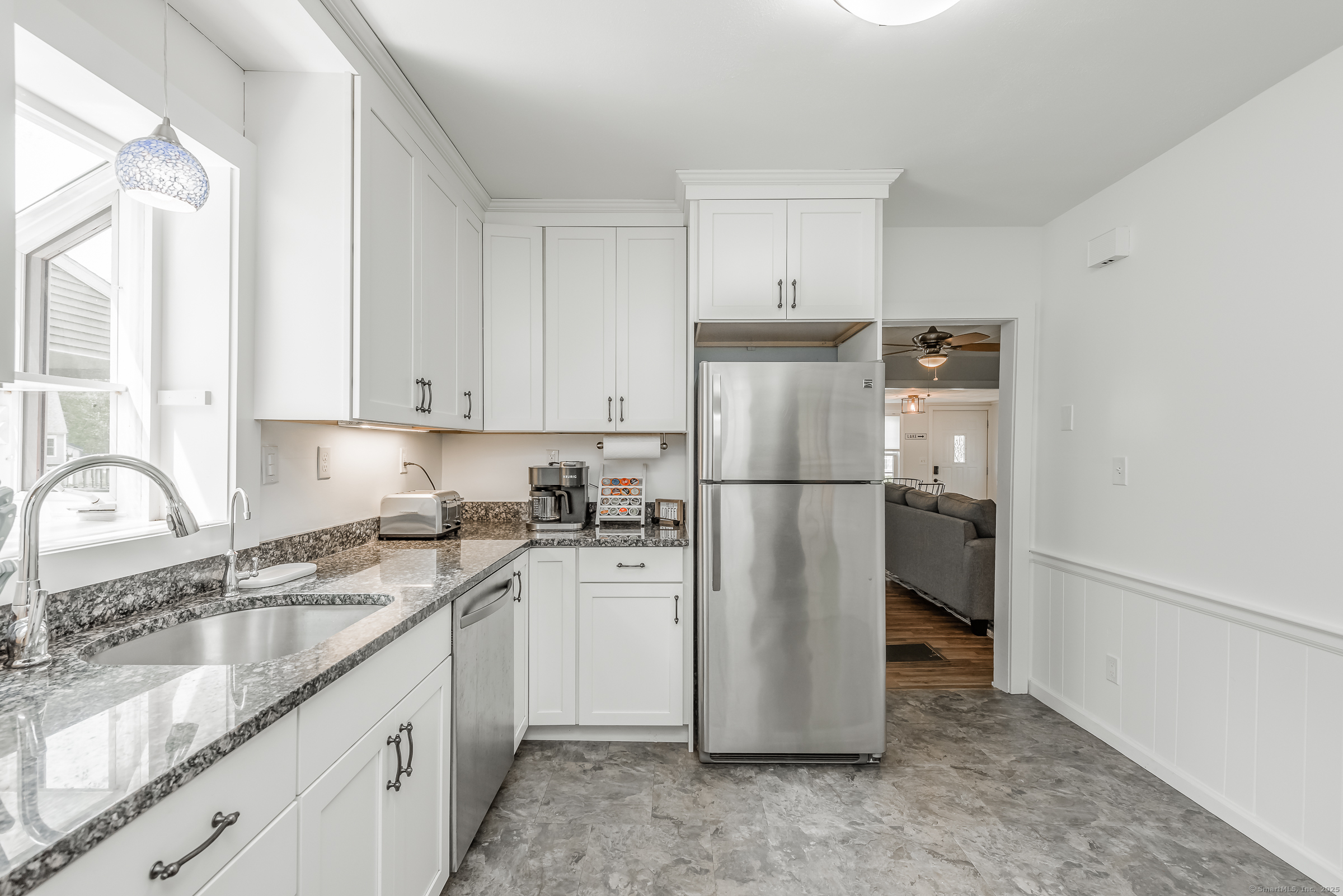 21 Elsmere Road Hebron, CT 06231 - Photo 8 of 31 a kitchen with a refrigerator sink stove and cabinets