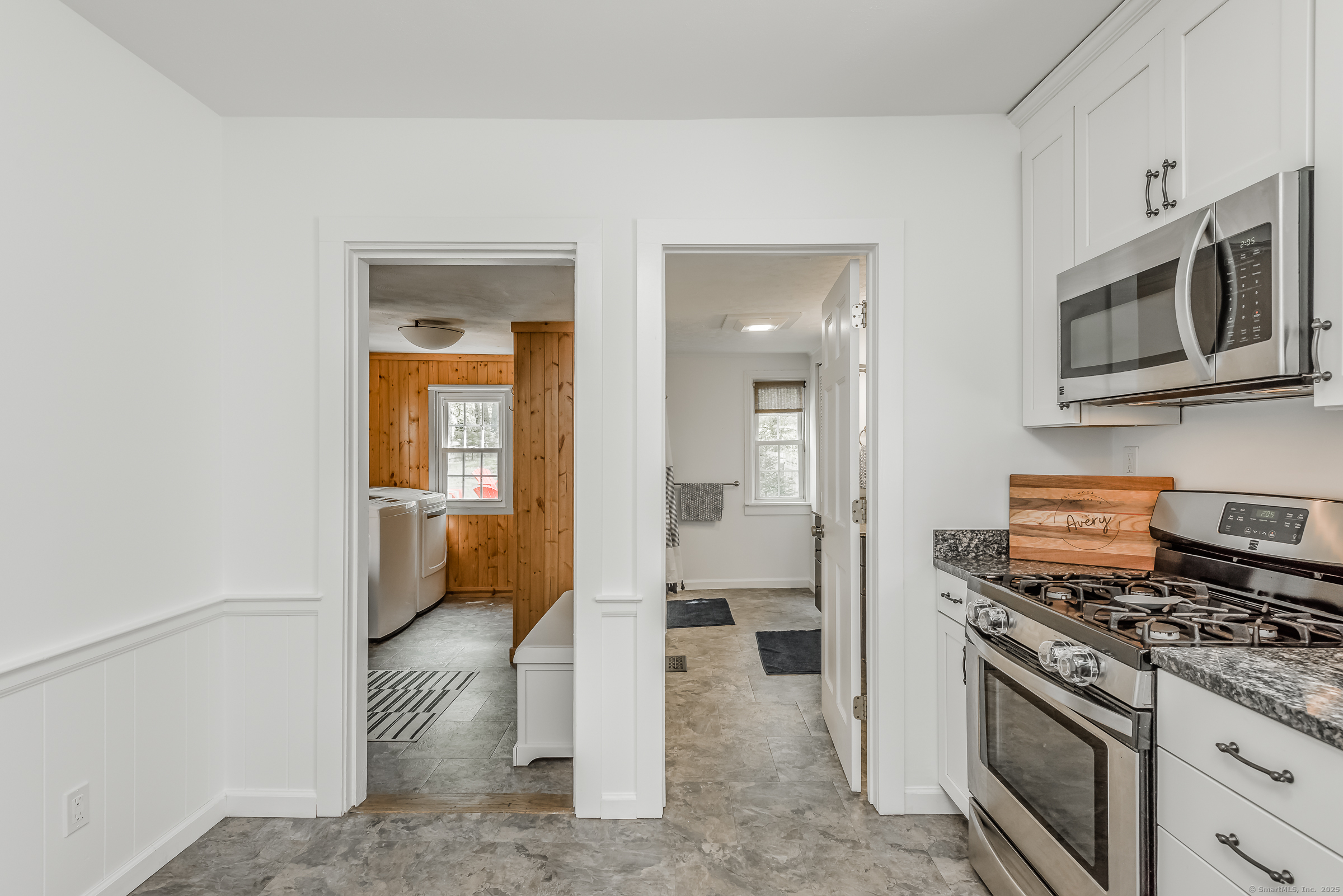 21 Elsmere Road Hebron, CT 06231 - Photo 10 of 31 a kitchen with stainless steel appliances a stove and a microwave