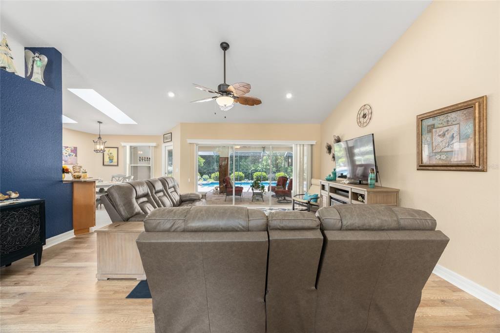18825 Southwest 93rd Loop Dunnellon, FL 34432 - Photo 16 of 85 a living room with furniture kitchen and a chandelier