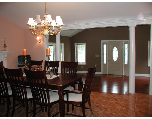 641 Marys Pond Road Rochester, MA 02770 - Photo 6 of 12 a view of a dining room with furniture and chandelier