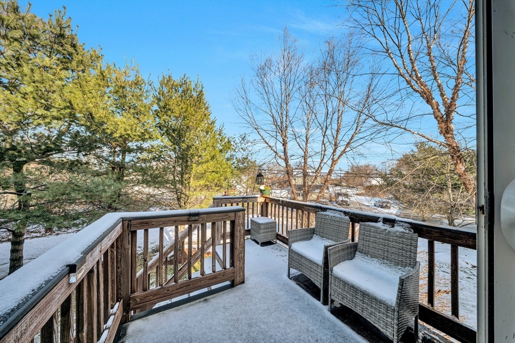 41 Boston Road, Unit 121 Billerica, MA 01862 - Photo 4 of 13 a view of a roof deck with wooden fence and floor