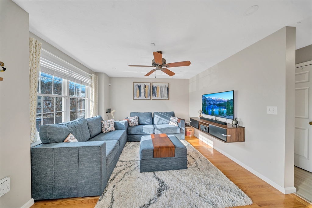 41 Boston Road, Unit 121 Billerica, MA 01862 - Photo 6 of 13 a living room with furniture and a window