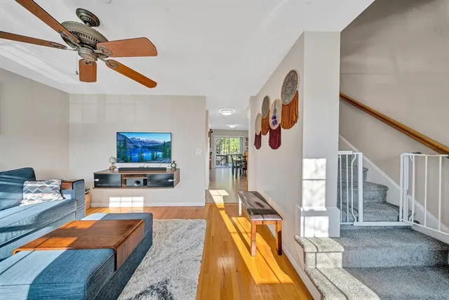 a living room with furniture and a pool table