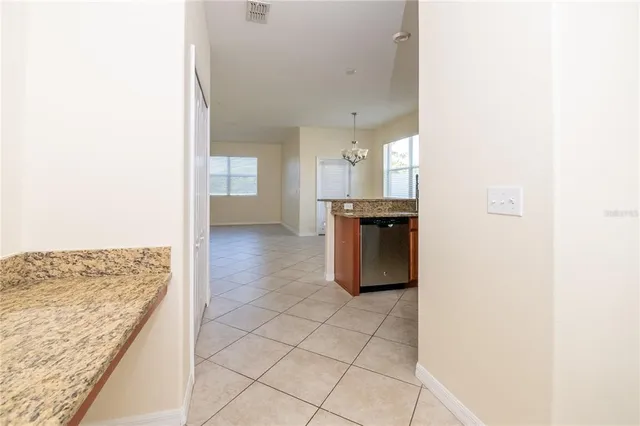 a view of a kitchen cabinets and a counter top space