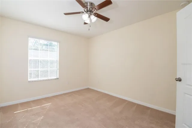 a bathroom with a granite countertop sink toilet a mirror and bathtub