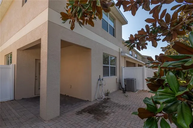 a view of a house with a tree