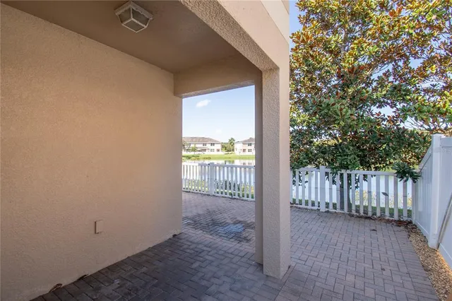 a view of a swimming pool with a patio